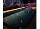 Relaxing pool at night with lighting and screened enclosure at 524 Arneson Ave, Auburndale, FL 33823