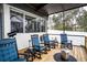 Relaxing screened porch with rocking chairs at 524 Arneson Ave, Auburndale, FL 33823