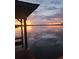 Sunset view over calm lake water at 524 Arneson Ave, Auburndale, FL 33823
