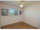 Light pink bedroom with wood floors and ceiling fan at 615 E Haines Blvd, Lake Alfred, FL 33850