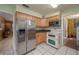 Kitchen boasts stainless steel appliances and ample cabinetry at 615 E Haines Blvd, Lake Alfred, FL 33850
