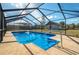 Inviting screened pool with a spa and a spacious deck at 615 E Haines Blvd, Lake Alfred, FL 33850