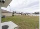 Large backyard with grassy area and space for outdoor activities at 723 Chinoy Rd, Davenport, FL 33837