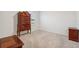 Simple bedroom with wooden dresser and carpeted floor at 723 Chinoy Rd, Davenport, FL 33837