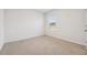 Empty bedroom with carpeted floors and window at 723 Chinoy Rd, Davenport, FL 33837