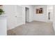 Bright hallway with neutral walls and carpeted floor at 723 Chinoy Rd, Davenport, FL 33837