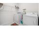 Laundry room with washer, dryer, and storage shelves at 723 Chinoy Rd, Davenport, FL 33837
