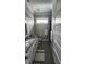 Clean bathroom with gray tile floor and white vanity at 780 Waterfern Trail Dr, Auburndale, FL 33823