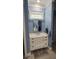 Bathroom vanity with a shiplap cabinet and a quartz countertop at 780 Waterfern Trail Dr, Auburndale, FL 33823