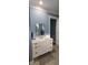 Bathroom vanity with a shiplap cabinet and a quartz countertop at 780 Waterfern Trail Dr, Auburndale, FL 33823