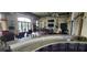 Community bar with granite countertop and seating area at 780 Waterfern Trail Dr, Auburndale, FL 33823