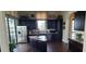 Modern community kitchen with granite island and stainless steel appliances at 780 Waterfern Trail Dr, Auburndale, FL 33823