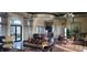 Elegant community room with comfortable seating and a kitchenette at 780 Waterfern Trail Dr, Auburndale, FL 33823
