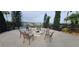 Relaxing fire pit area with seating, overlooking a lake at 780 Waterfern Trail Dr, Auburndale, FL 33823