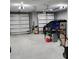Two-car garage with plenty of space for parking and storage at 780 Waterfern Trail Dr, Auburndale, FL 33823