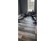 Modern gym with rowing machines and wood-look flooring at 780 Waterfern Trail Dr, Auburndale, FL 33823