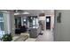 Open concept kitchen with granite island, stainless steel appliances, and views to living area at 780 Waterfern Trail Dr, Auburndale, FL 33823