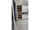 Well-organized kitchen pantry with pull-out shelves and ample storage space at 780 Waterfern Trail Dr, Auburndale, FL 33823