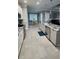 Spacious kitchen boasts granite countertops, stainless steel appliances, and an island at 780 Waterfern Trail Dr, Auburndale, FL 33823