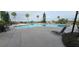 Freeform pool with lounge chairs and seating at 780 Waterfern Trail Dr, Auburndale, FL 33823