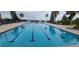 Lap pool with lounge chairs and waterfront views at 780 Waterfern Trail Dr, Auburndale, FL 33823