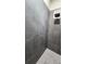 Modern shower with gray tile and rainfall shower head at 780 Waterfern Trail Dr, Auburndale, FL 33823