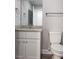 Bathroom featuring granite countertop, chrome hardware, tile flooring, and neutral colored walls at 809 Lincoln St, Babson Park, FL 33827