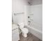 Bright bathroom with white shower-tub combination, granite countertop and chrome hardware at 809 Lincoln St, Babson Park, FL 33827