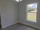Bedroom featuring a large window providing natural light and scenic views at 809 Lincoln St, Babson Park, FL 33827
