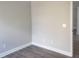 Corner view of a bedroom with an open doorway and neutral wall color at 809 Lincoln St, Babson Park, FL 33827