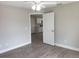 Bedroom view showcasing a ceiling fan and an open doorway to the modern kitchen at 809 Lincoln St, Babson Park, FL 33827