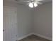 View of a bedroom with a modern ceiling fan and neutral paint at 809 Lincoln St, Babson Park, FL 33827