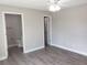 Bedroom featuring an open doorway leading to a bathroom with modern fixtures at 809 Lincoln St, Babson Park, FL 33827