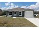 Charming single-story home featuring a one-car garage and well-maintained front yard at 809 Lincoln St, Babson Park, FL 33827