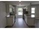 Open kitchen featuring stainless steel appliances, modern cabinetry, and a stylish island at 809 Lincoln St, Babson Park, FL 33827