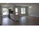 Modern kitchen featuring stainless steel appliances, granite countertops, and ample natural light at 809 Lincoln St, Babson Park, FL 33827