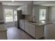 Updated kitchen boasting stainless steel appliances, granite counters, and an open floor plan at 809 Lincoln St, Babson Park, FL 33827