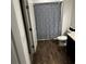 Bathroom with shower/tub combo and dark brown vanity at 932 Grandin St, Davenport, FL 33837