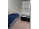 Bright bedroom with a twin bed, window blinds, and a storage bench at 932 Grandin St, Davenport, FL 33837