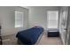 Spacious bedroom with two windows, a twin bed, and ample floor space at 932 Grandin St, Davenport, FL 33837