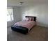 Bedroom with a queen bed and a bench at the foot of the bed at 932 Grandin St, Davenport, FL 33837