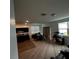 Open concept living room and kitchen with carpeted floors at 932 Grandin St, Davenport, FL 33837