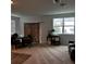 Living area with a sliding glass door and a small aquarium at 932 Grandin St, Davenport, FL 33837