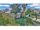 House with lush landscaping and palm trees at 1153 Legatto Loop, Dundee, FL 33838