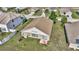 Backyard view showing patio and surrounding homes at 1153 Legatto Loop, Dundee, FL 33838