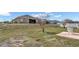 Spacious backyard with patio and grassy area at 1153 Legatto Loop, Dundee, FL 33838