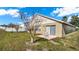 Landscaped backyard with patio and grass at 1153 Legatto Loop, Dundee, FL 33838
