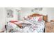 Bright bedroom with a comfortable bed and coastal-inspired bedding and decor at 1153 Legatto Loop, Dundee, FL 33838