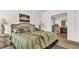 Main bedroom with ensuite bathroom and large windows at 1153 Legatto Loop, Dundee, FL 33838