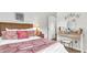 Lovely bedroom with a comfortable bed, vanity, and elegant decor at 1153 Legatto Loop, Dundee, FL 33838